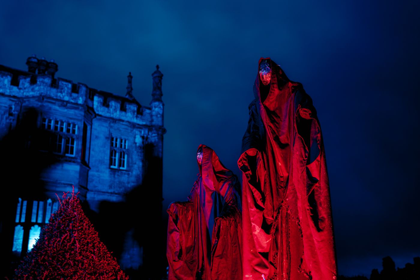 Hooded figures outside Margam Castle